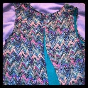 Colorful loose tank top flows freely overlay